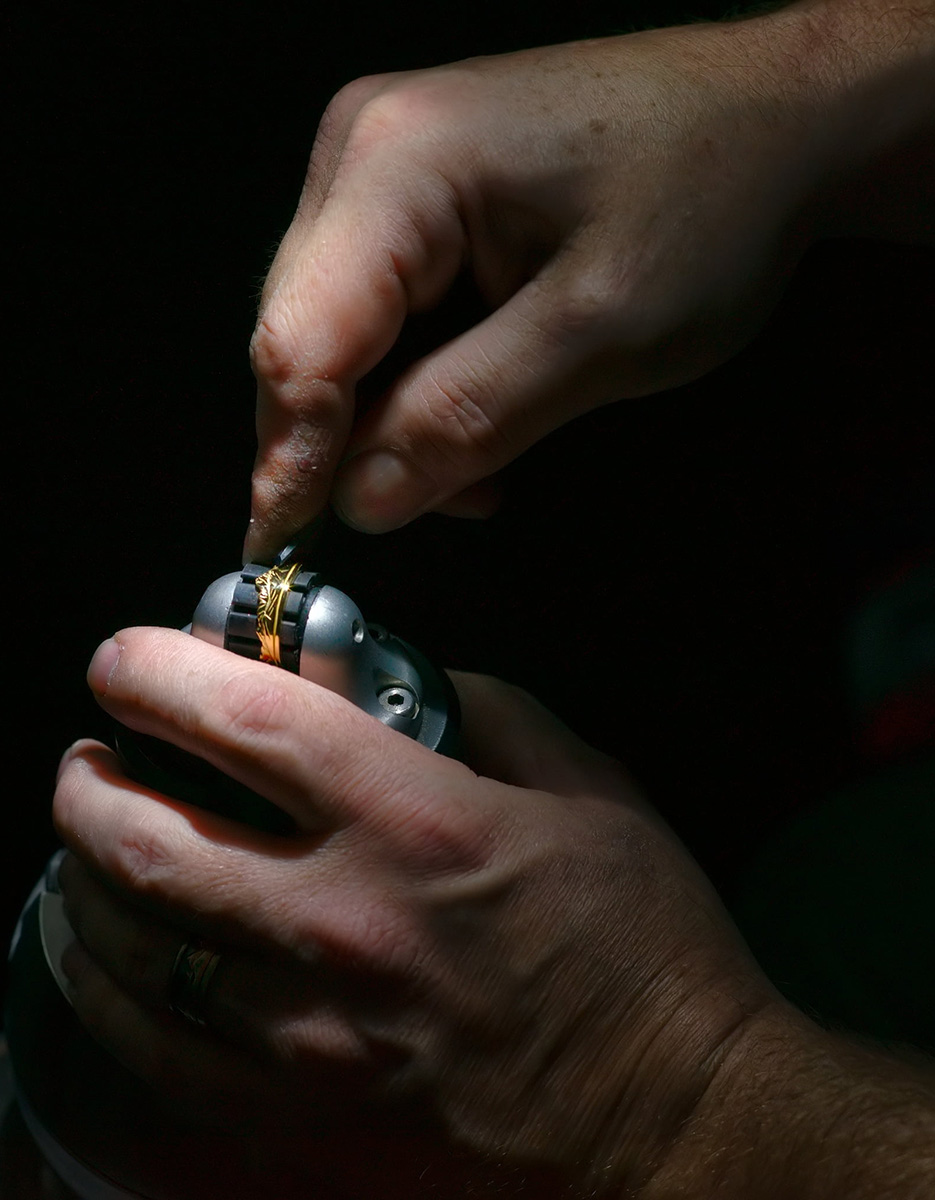 Josh Kline's hands handcarving jewelry